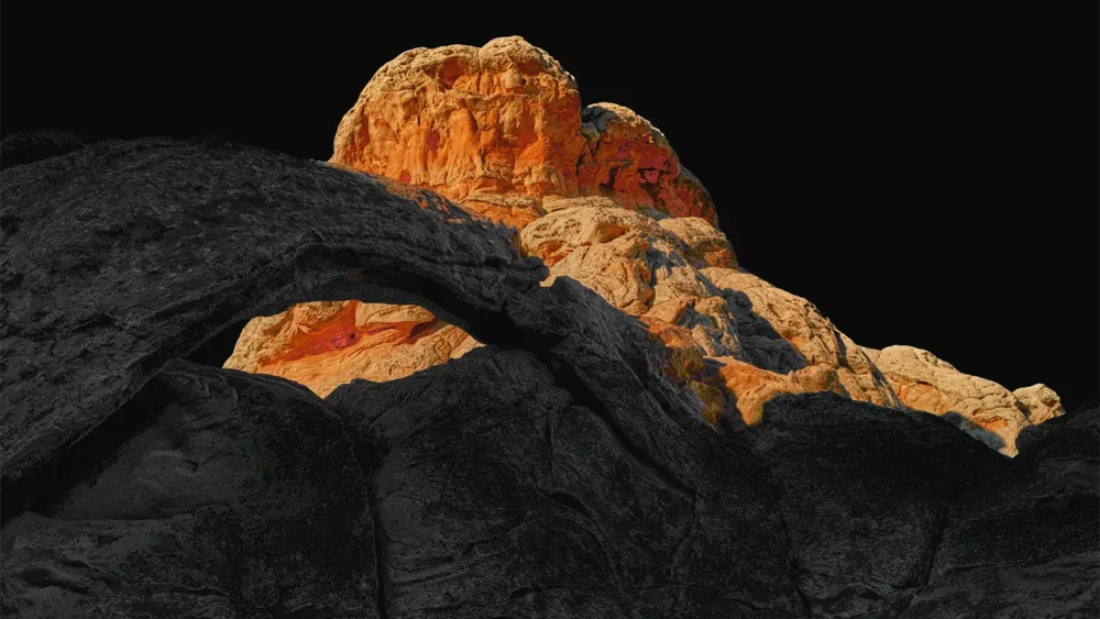 The Arch of White Pocket — glowing orange Navajo sandstone meets dark volcanic rock at the geological contact zone, Vermilion Cliffs National Monument, Arizona. Fujifilm GFX