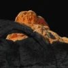 The Arch of White Pocket — glowing orange Navajo sandstone meets dark volcanic rock at the geological contact zone, Vermilion Cliffs National Monument, Arizona. Fujifilm GFX