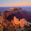 Wotan's Throne butte formation at sunrise, lit in warm rose and gold, Grand Canyon North Rim, Arizona. Fujifilm GFX medium format fine art photograph