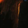 The rare February firefall phenomenon on Horsetail Fall, Yosemite Valley — the setting sun aligning with the east-facing granite face to illuminate the waterfall as burning orange fire. Yosemite National Park, California. Fine art landscape photograph. Nikon D810.