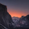 El Capitan and Half Dome in winter dawn alpenglow, snow on the valley floor, viewed from Tunnel View. Yosemite National Park, California. Nikon D810